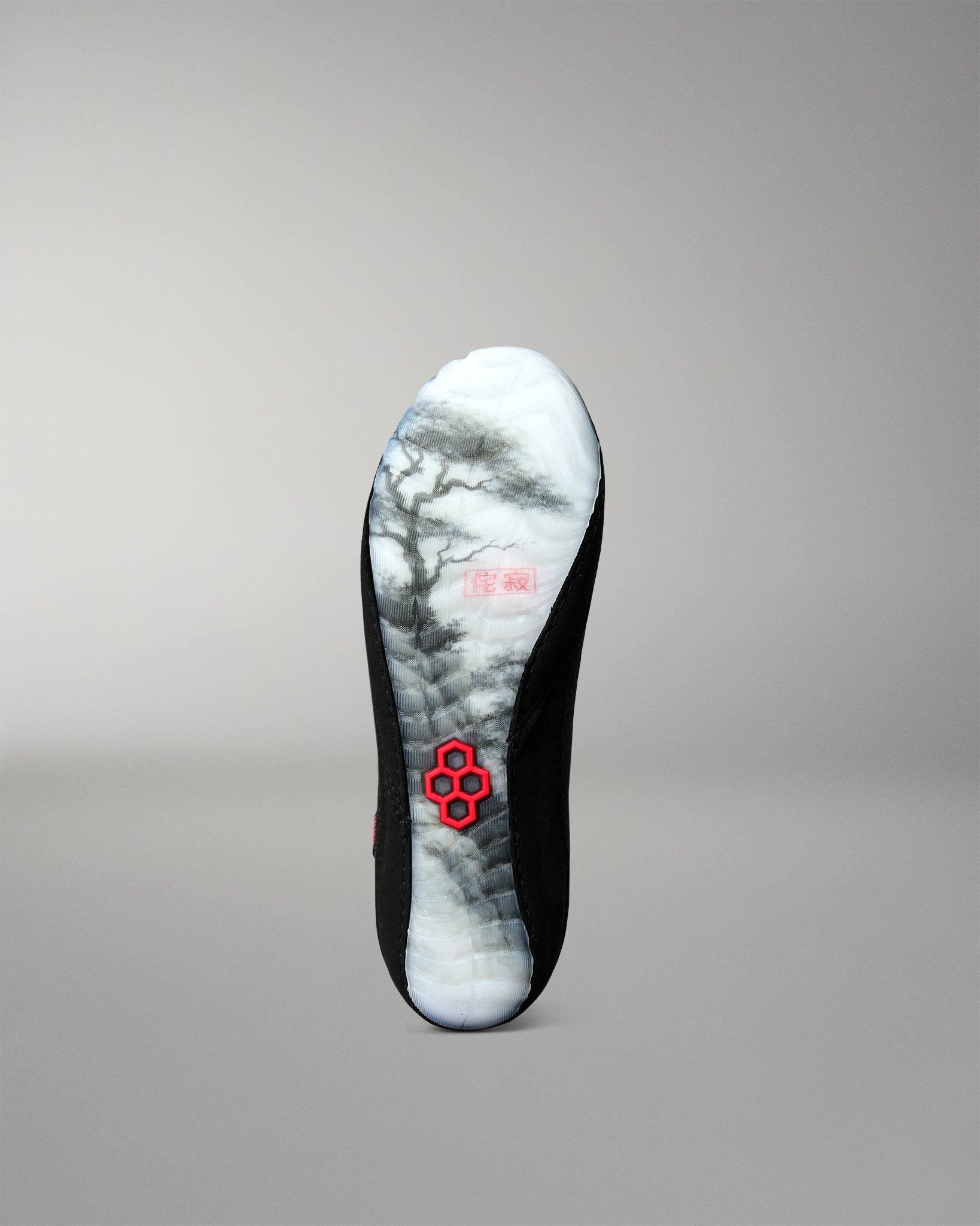 Bottom view of the RUDIS Samurai Speed Youth Wabi-Sabi wrestling shoe featuring a translucent outsole with Japanese-inspired landscape artwork and red RUDIS emblem.