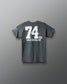 Gray t-shirt with '74 KG GOLD MEDALIST' text on the back against a gray background