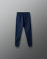 Navy blue jogger pants on a gray background
