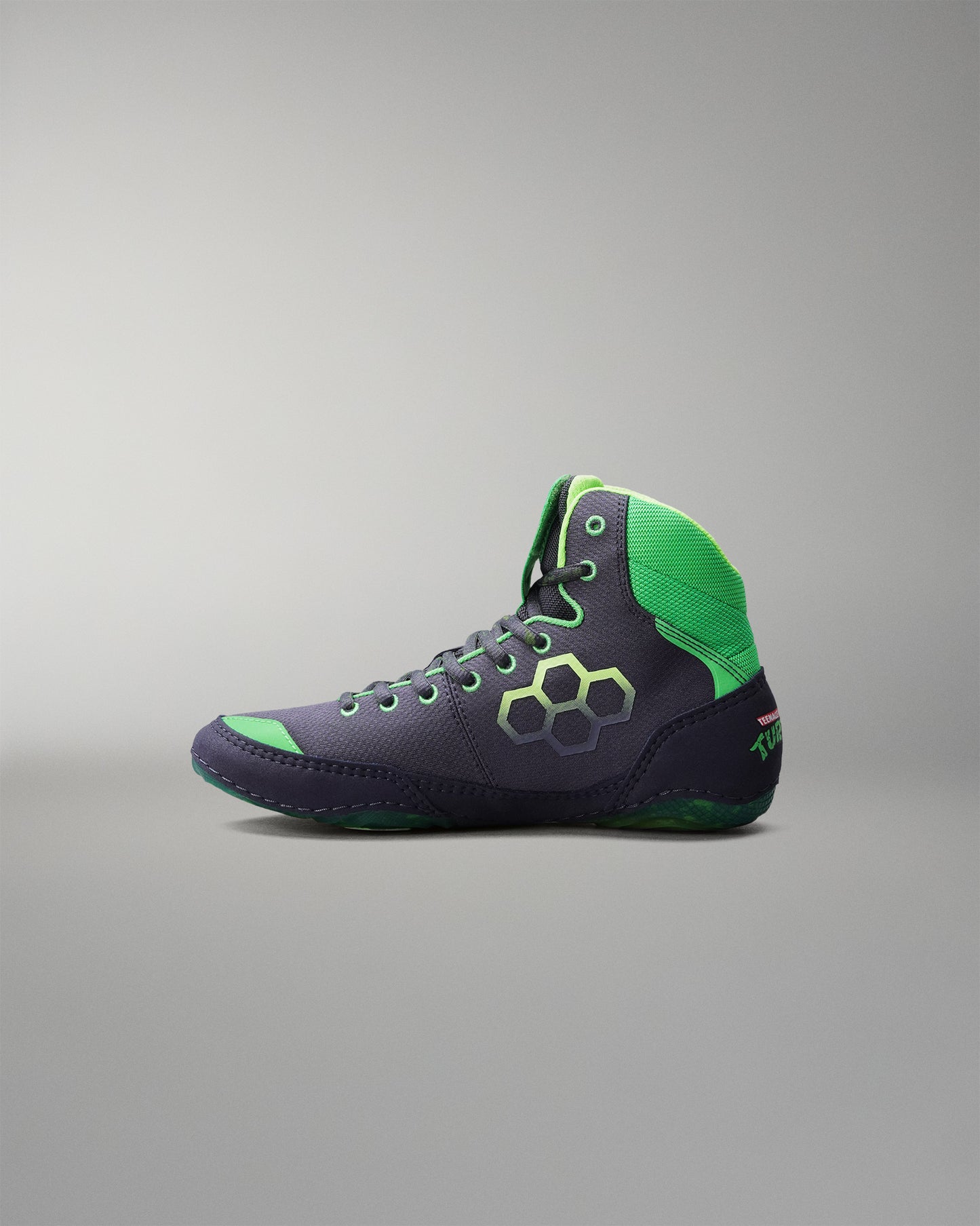 Navy and green Wrestling shoe on a gray background