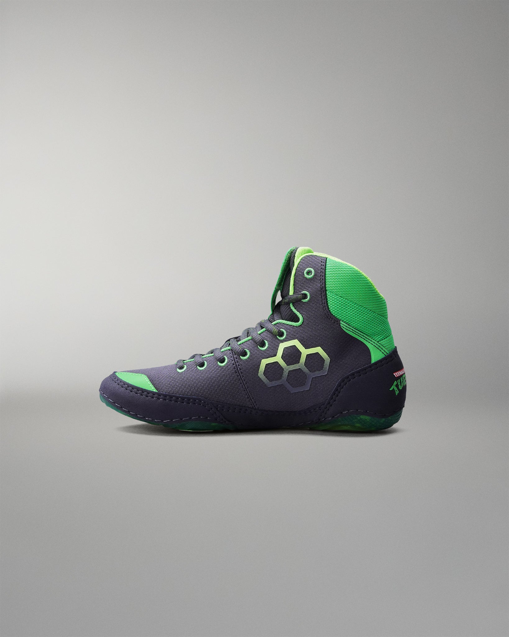 Navy and green Wrestling shoe on a gray background