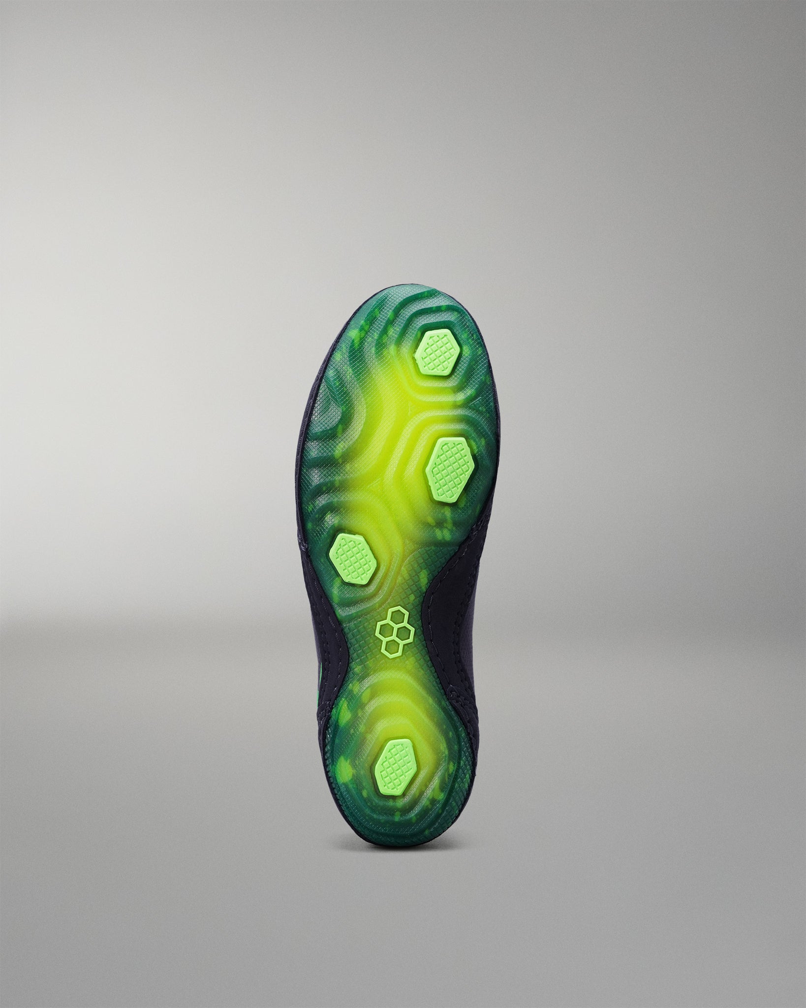 Green and black Wrestling shoe sole on a gray background