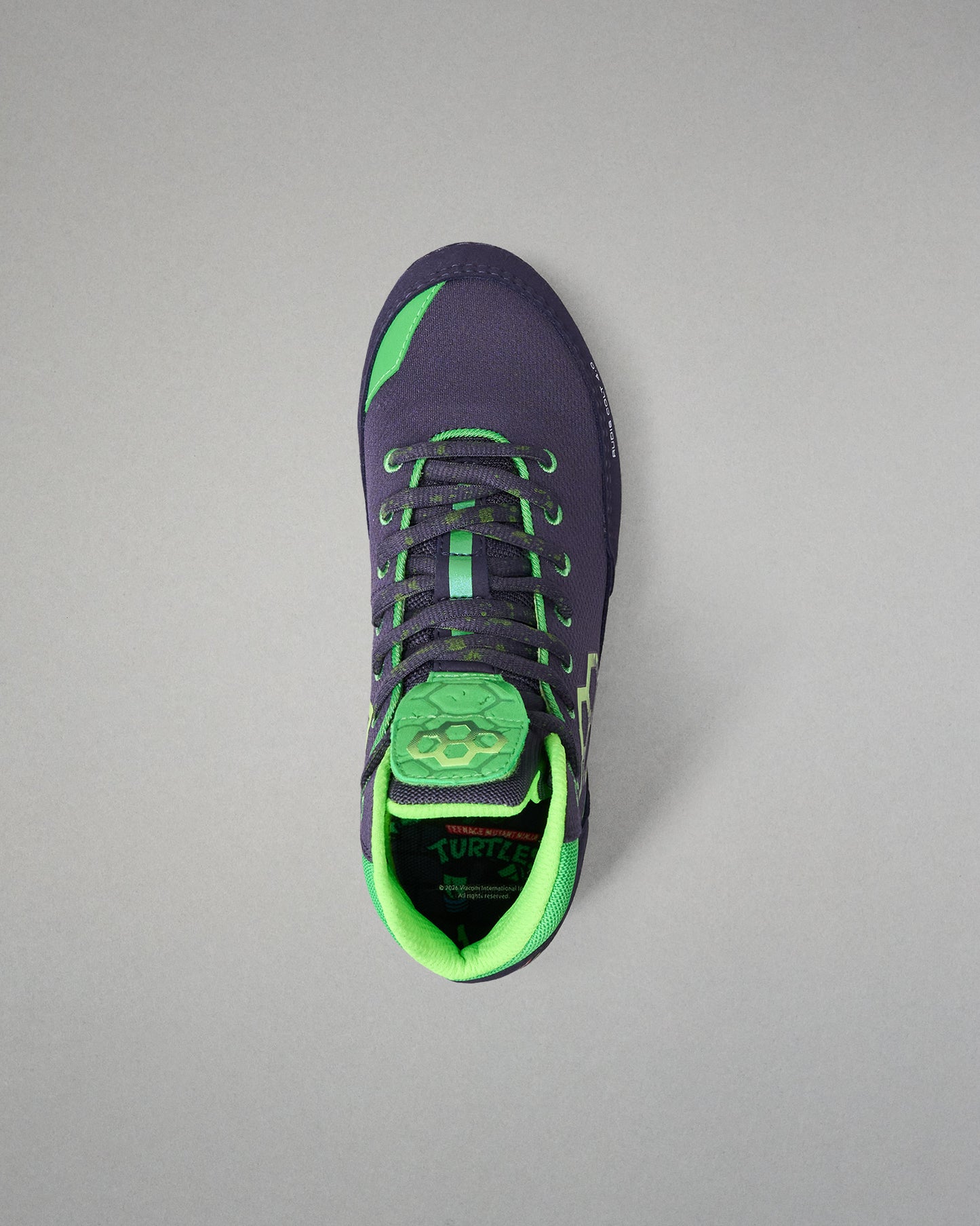 Navy and green Wrestling shoe on a gray background