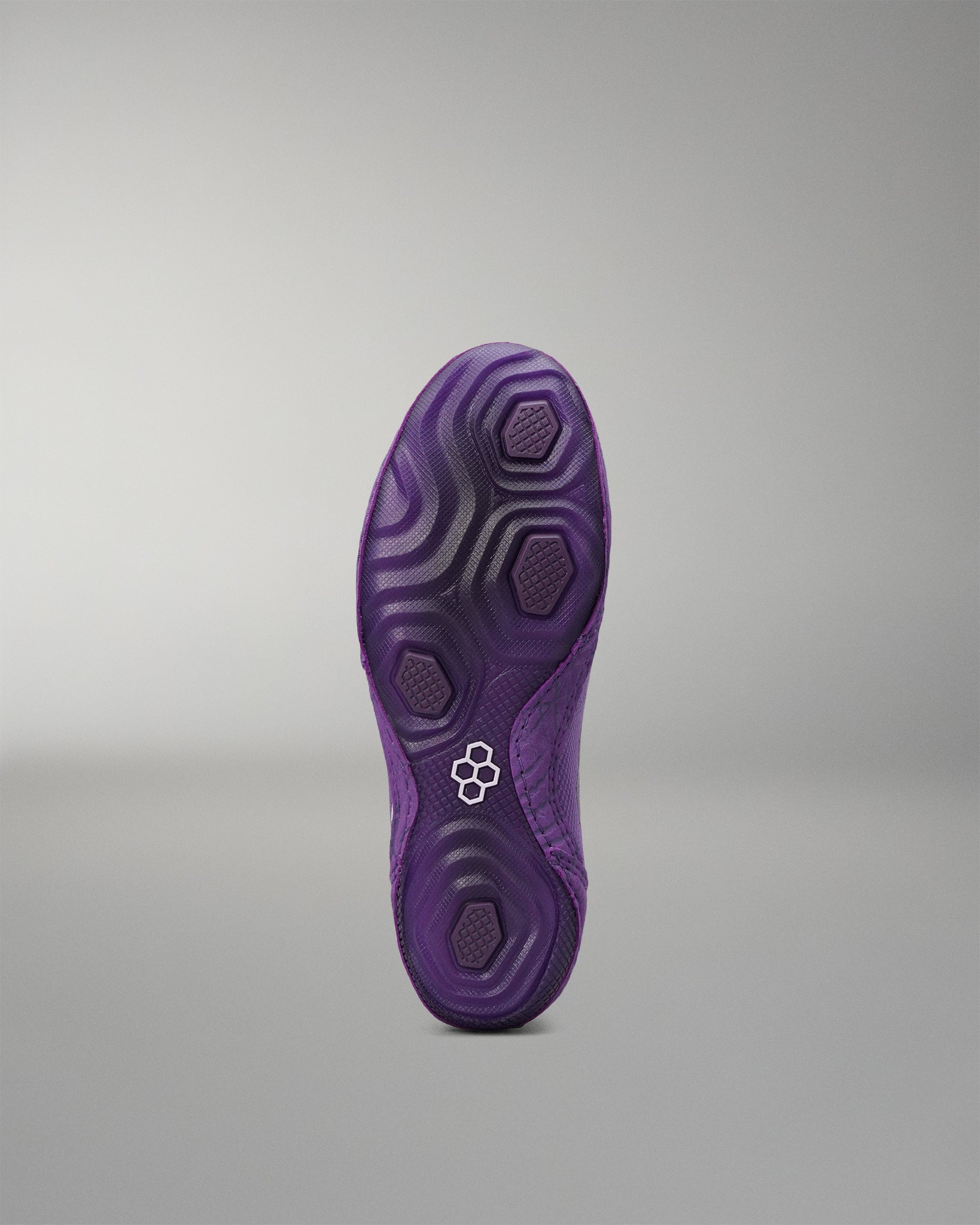 Purple outsole of the RUDIS Colt 4.0 Shredder wrestling shoe.