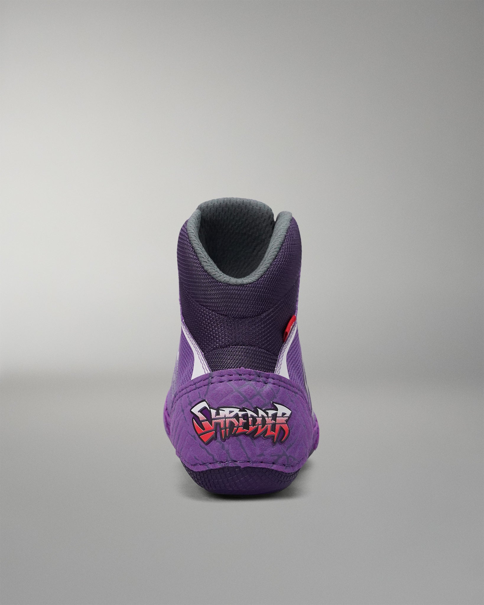 Rear view of the RUDIS Colt 4.0 Shredder wrestling shoe in purple, featuring exclusive Shredder heel branding, a padded high-top collar, and a performance-focused design built for comfort and support on the mat.