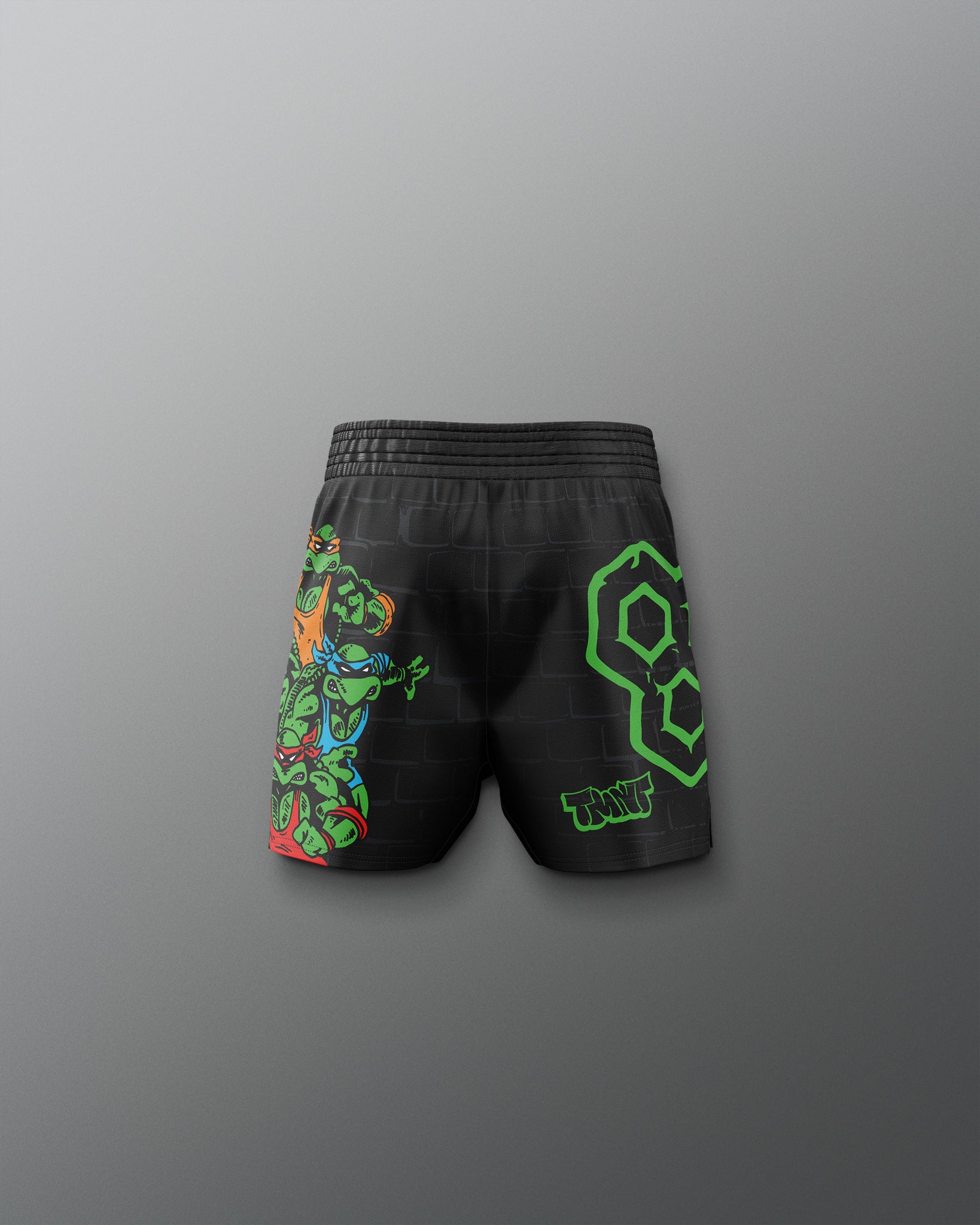 Black shorts with colorful designs on a gray background. TMNT. Teenage Mutant Ninja Turtle