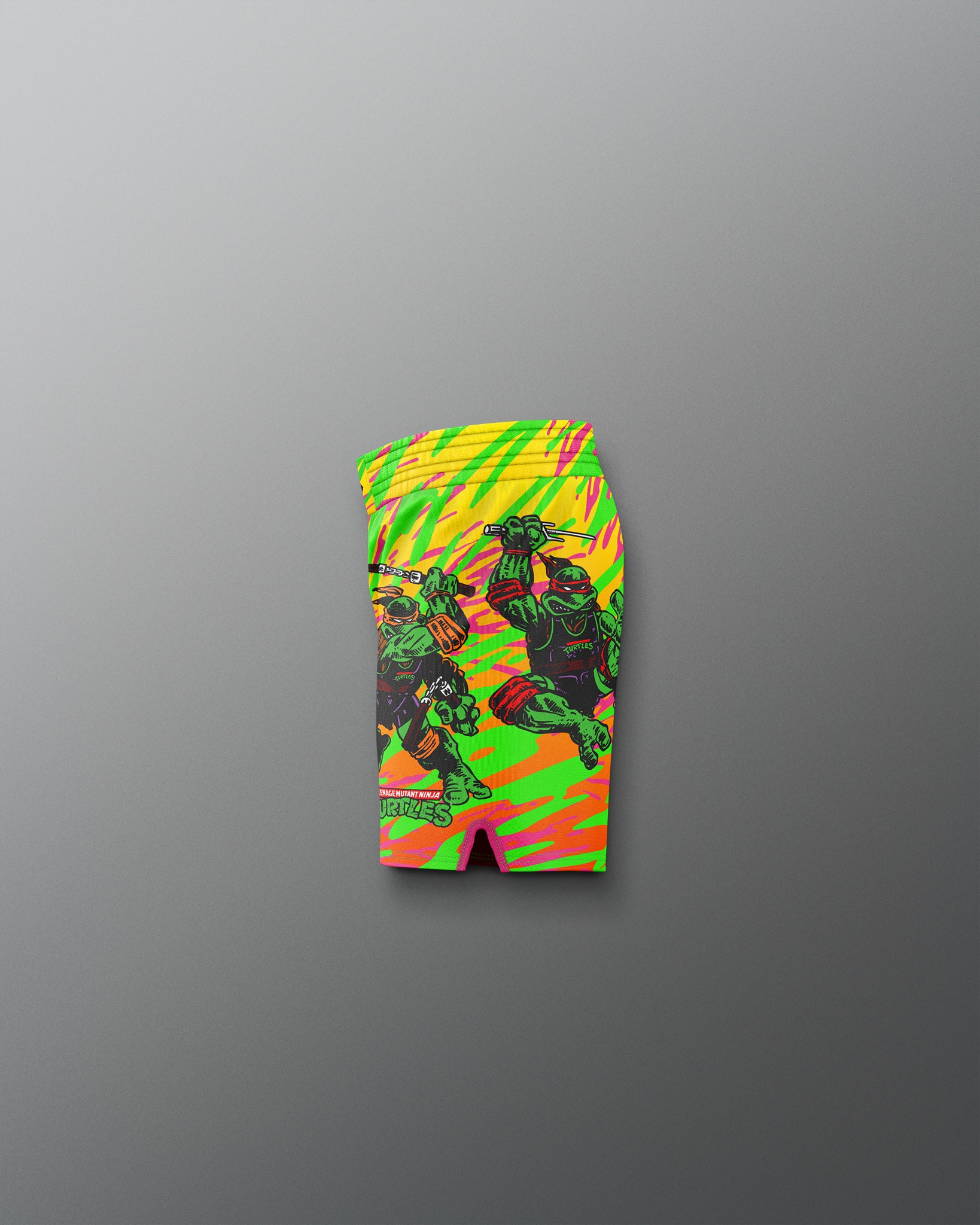 Colorful swim shorts with a graphic design on a gray background