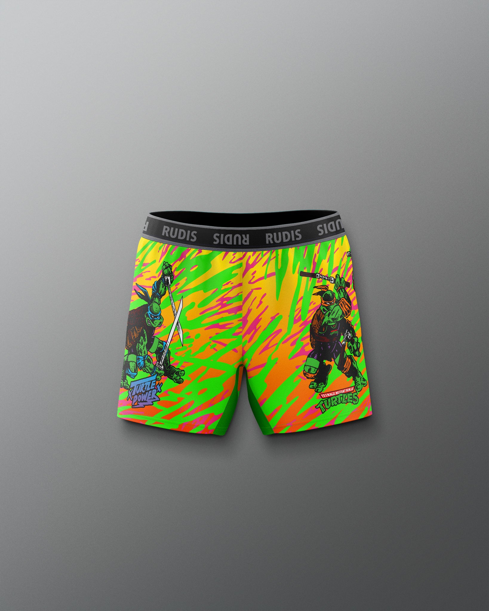 Colorful swim shorts with graphic design on a gray background