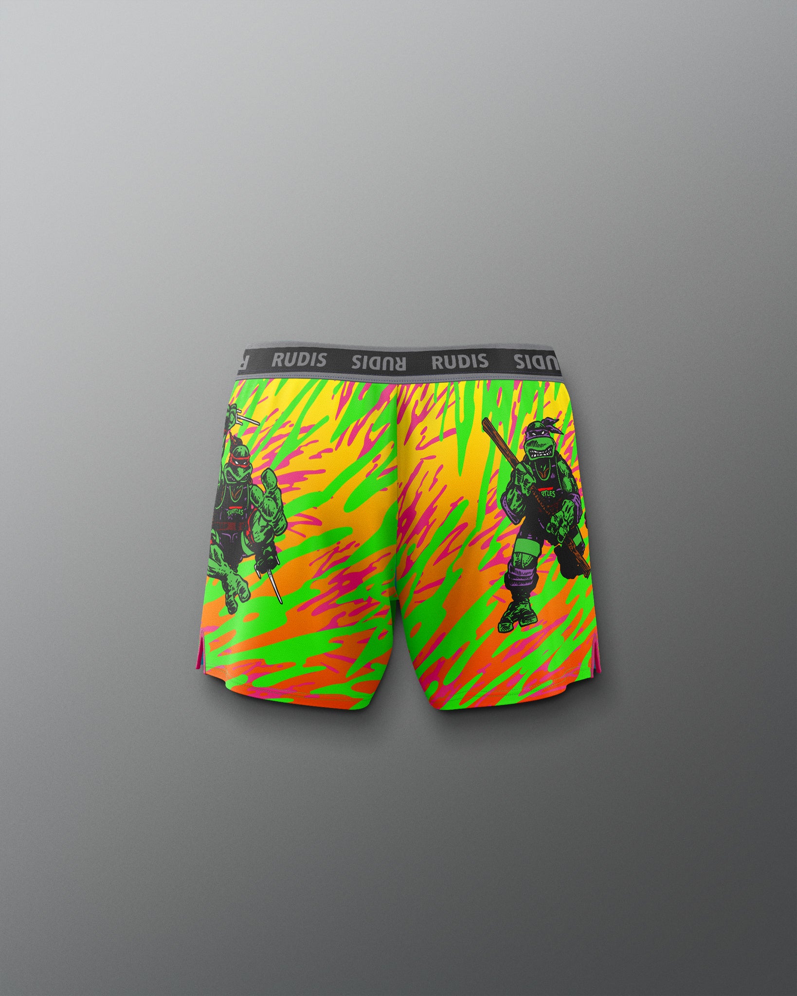 Colorful swim shorts with a graphic design on a gray background