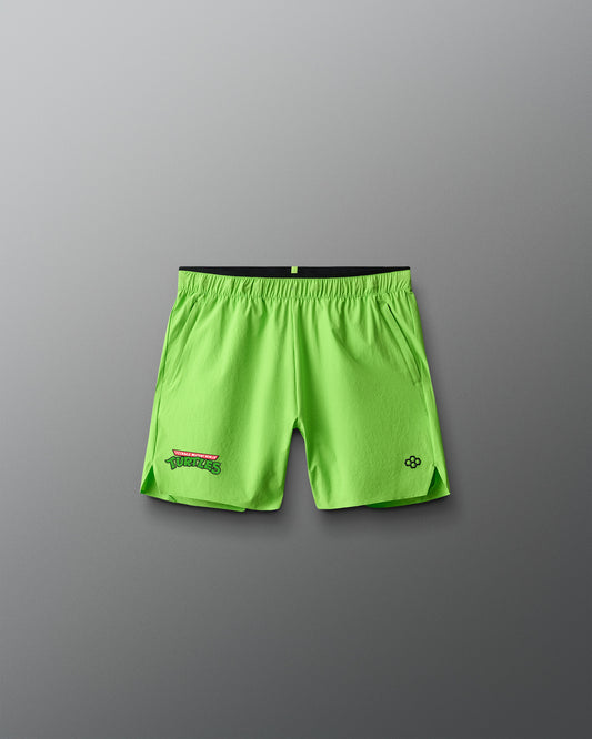 Green athletic shorts with a Teenage Mutant Ninja Turtles brand logo on a gray background
