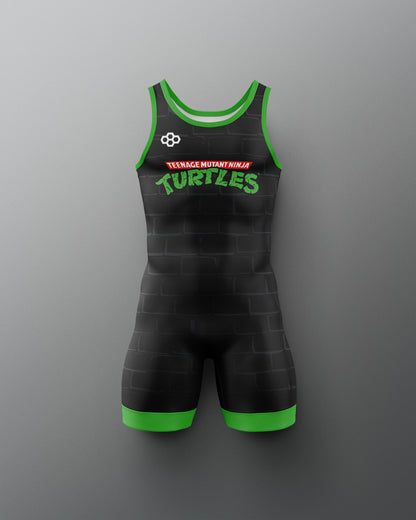 Black wrestling singlet with green accents and 'Teenage Mutant Ninja Turtles' logo on a gray background. TMNT