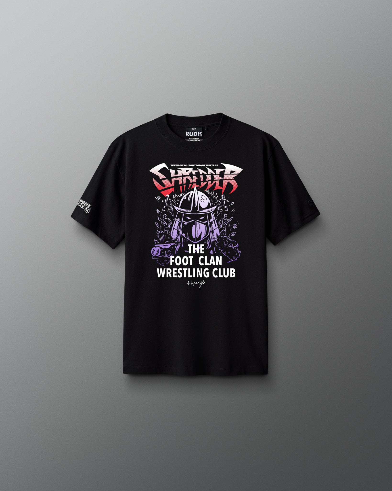 Black t-shirt with wrestling graphic teenage mutant ninja turtle shredder and text on a gray background
