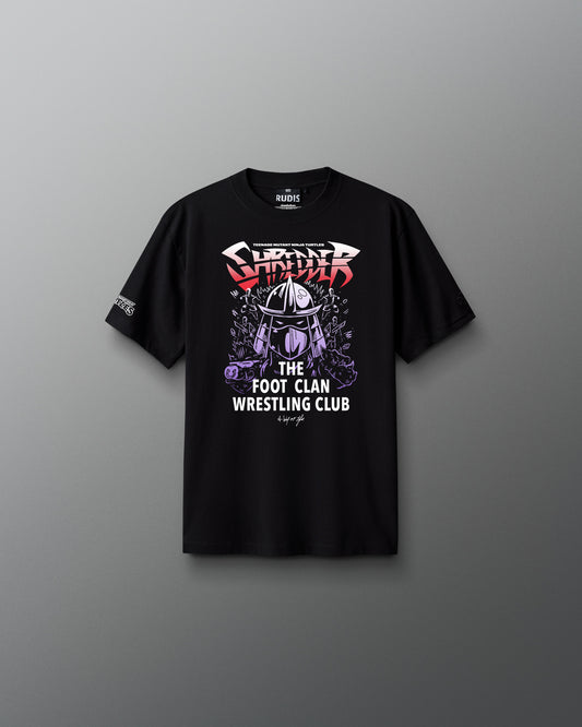 Black t-shirt with wrestling graphic teenage mutant ninja turtle shredder and text on a gray background