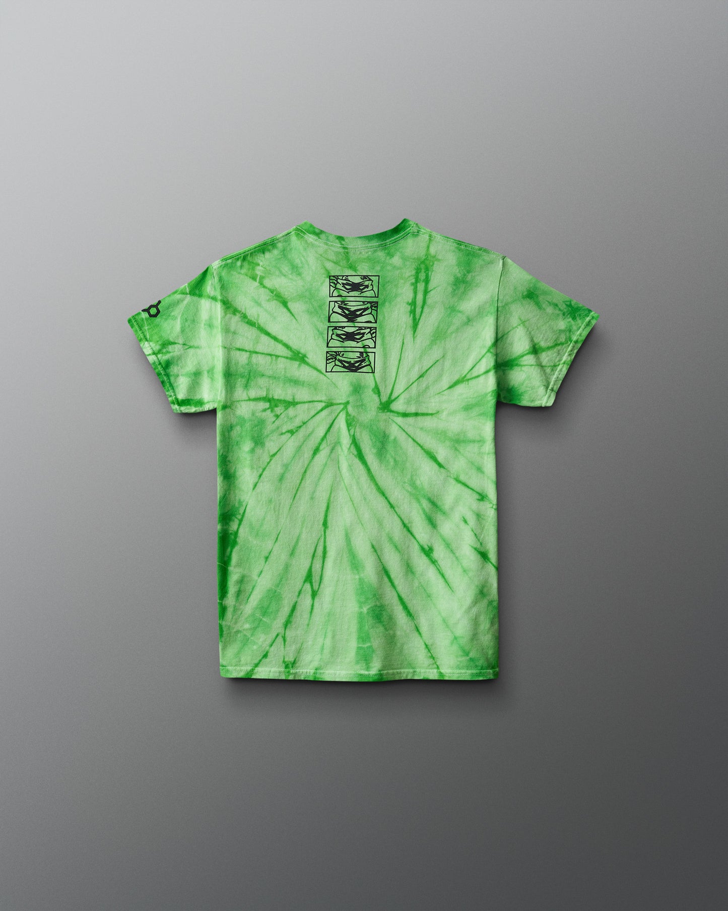 Green tie-dye t-shirt with a graphic on the chest against a gray background. TMNT. Teenage Mutant Ninja Turtles