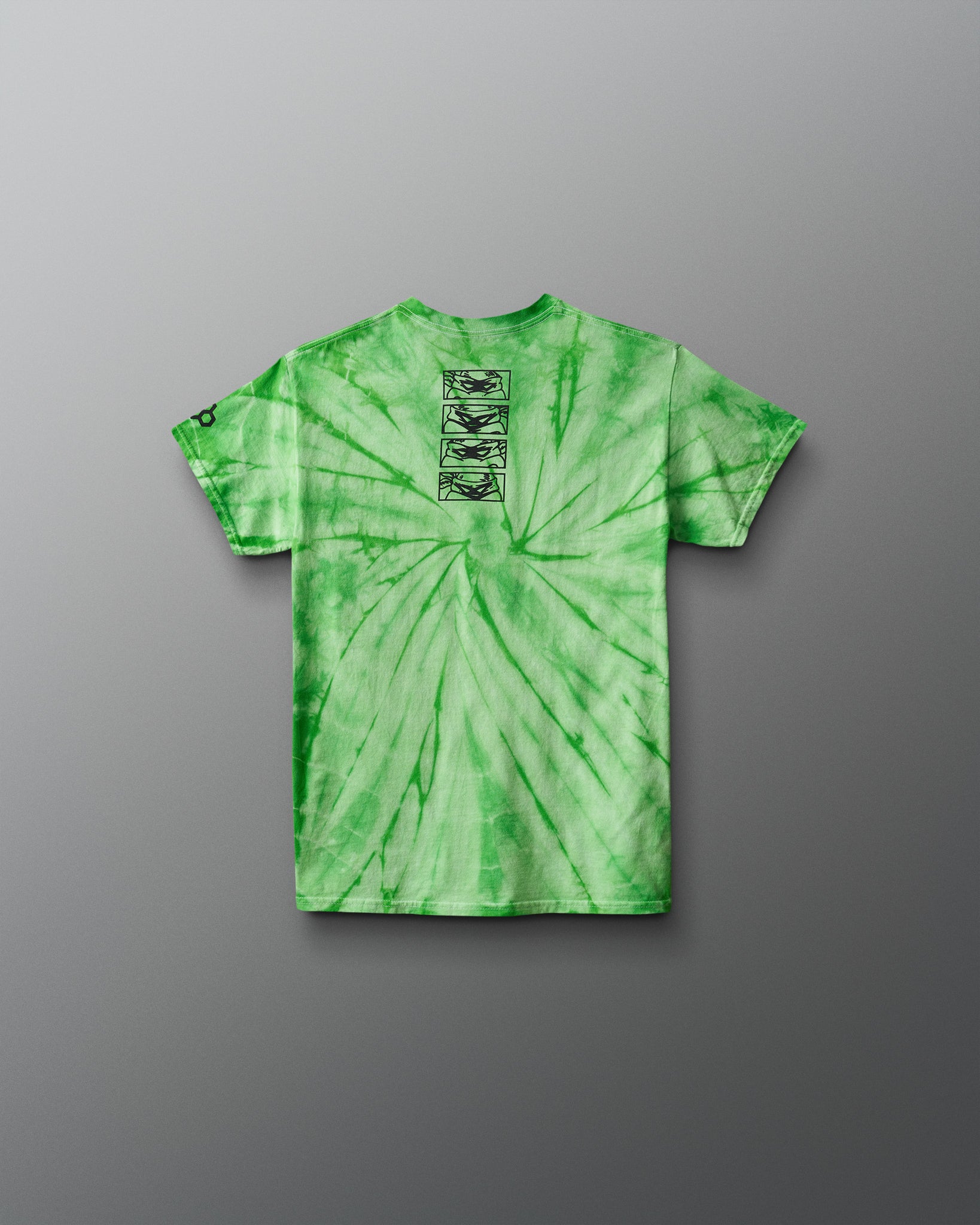 Green tie-dye t-shirt with a graphic on the chest against a gray background. TMNT. Teenage Mutant Ninja Turtles