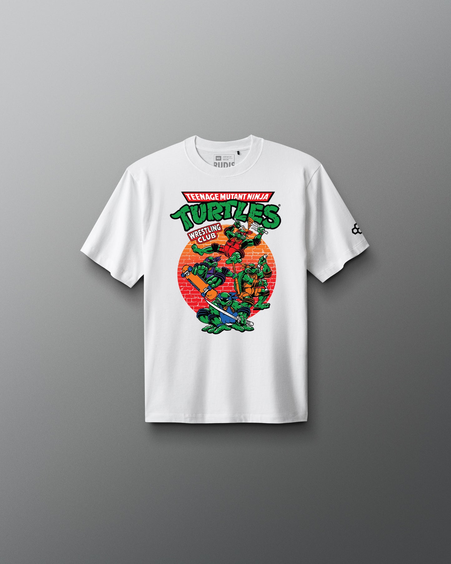 White t-shirt with Teenage Mutant Ninja Turtles graphic on a gray background