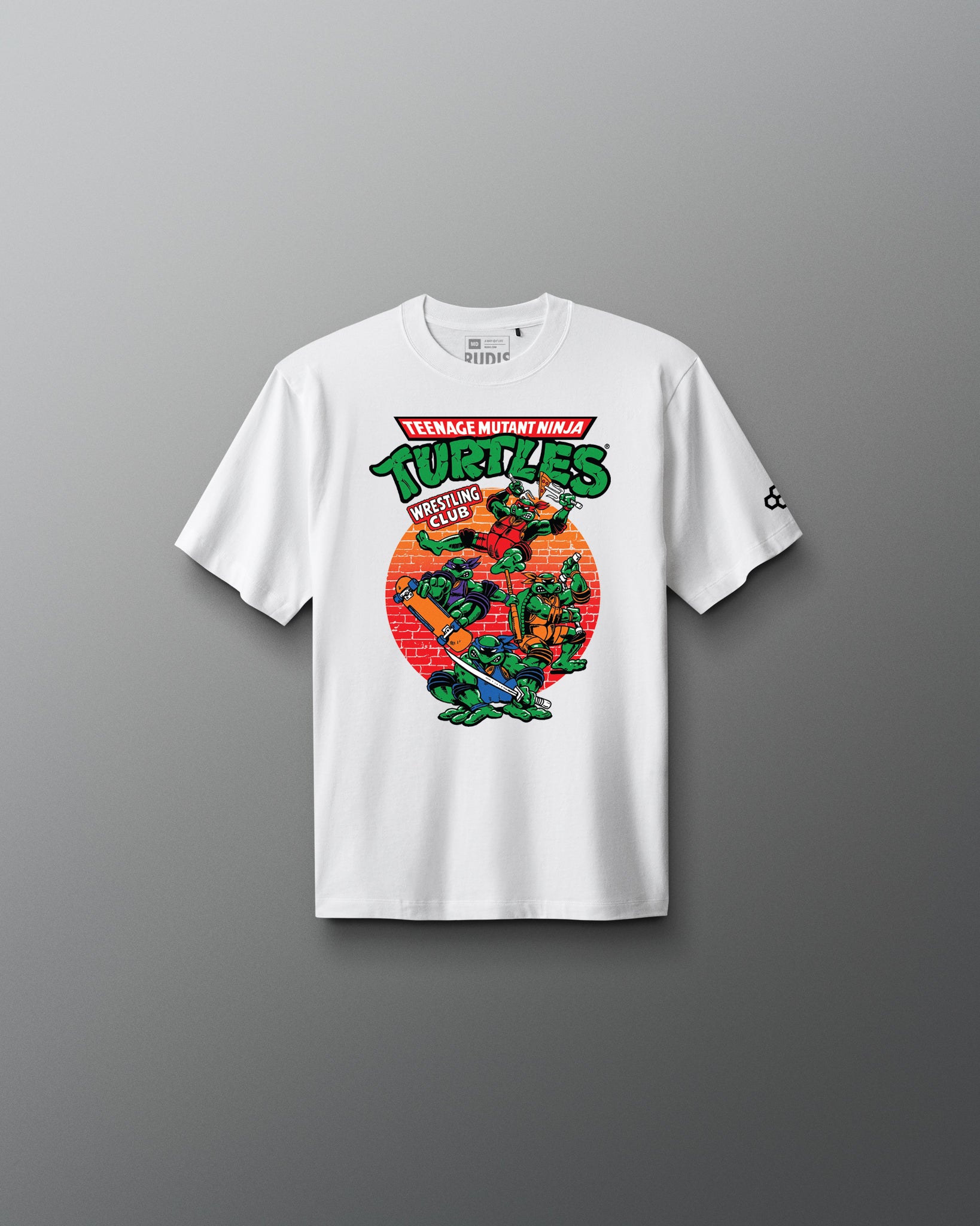 White t-shirt with Teenage Mutant Ninja Turtles graphic on a gray background