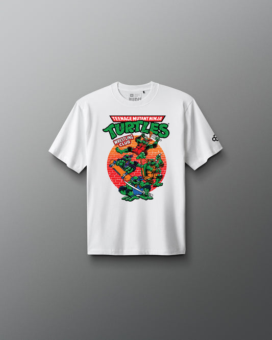 White t-shirt with Teenage Mutant Ninja Turtles graphic on a gray background