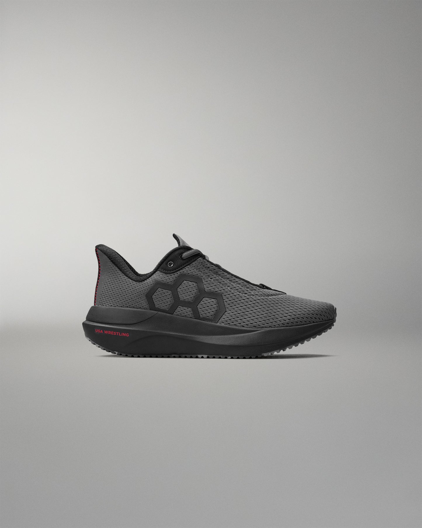 Gray athletic shoe on a gray background