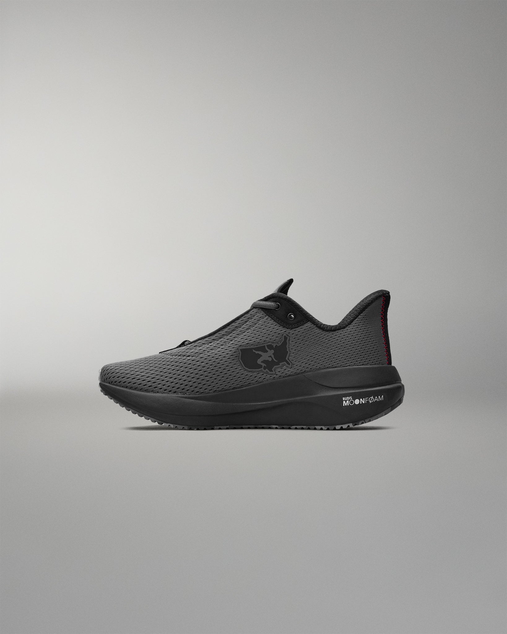 Black athletic shoe on a gray background