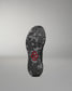 Black shoe sole with a red hexagonal logo on a gray background