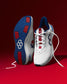 White running shoes with blue and red accents on a red background