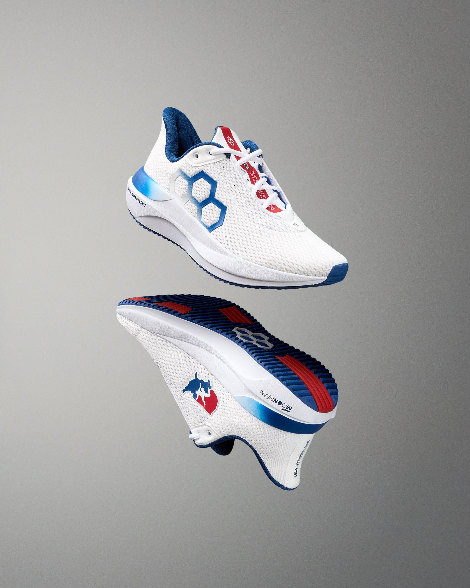 White running shoe with blue and red accents on a gray background