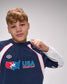Person wearing a USA Wrestling shirt on a gray background