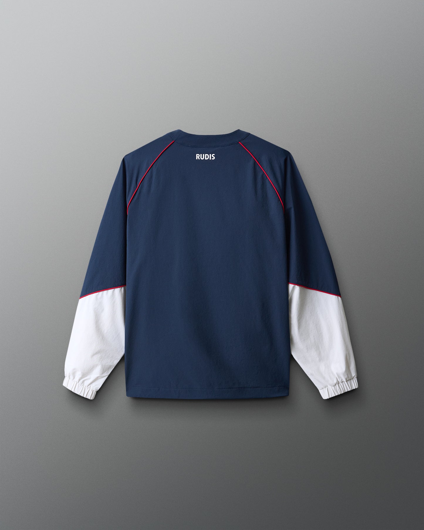 Navy and white long-sleeve shirt with 'RUDIS' branding on a gray background