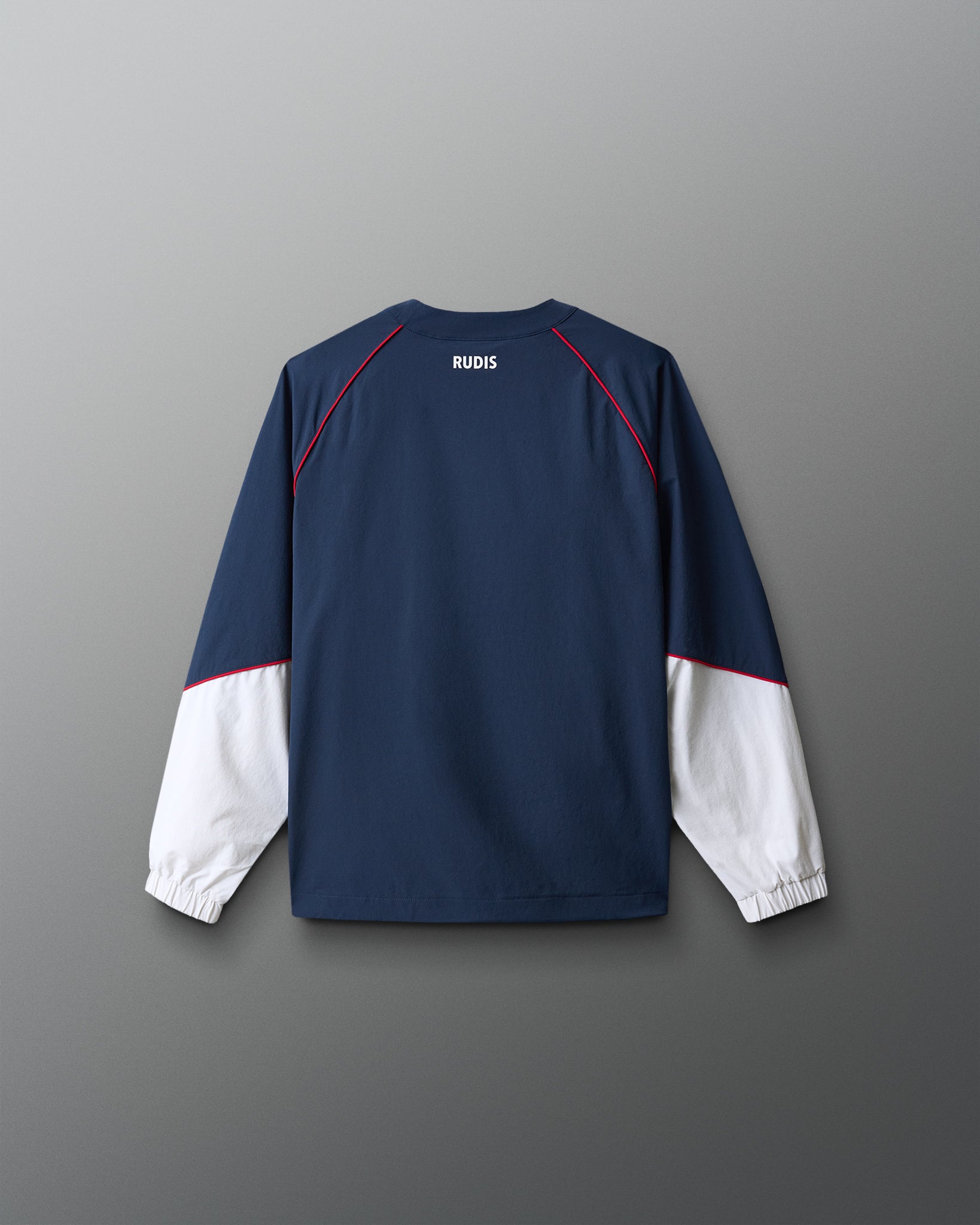 Navy and white long-sleeve shirt with 'RUDIS' branding on a gray background