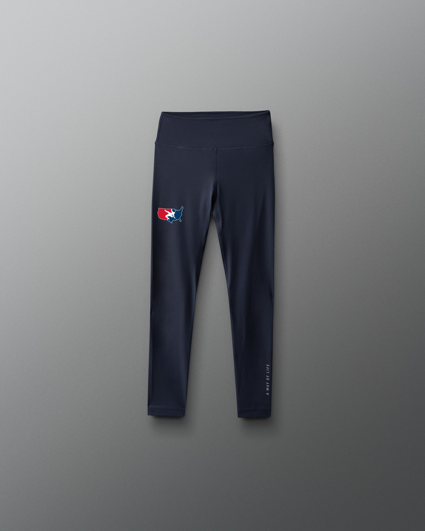 Navy leggings with a 'USA Wrestling' logo on a gray background