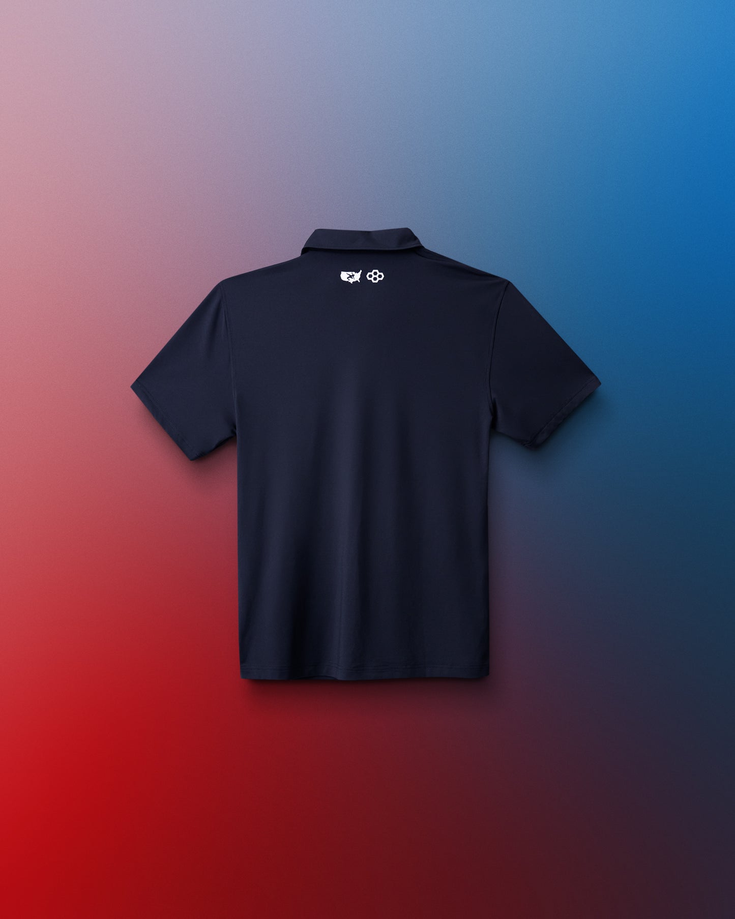 Black polo shirt with a logo on the back against a gradient red to blue background