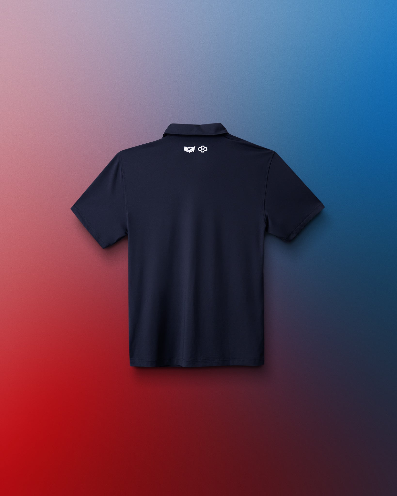 Black polo shirt with a logo on the back against a gradient red to blue background
