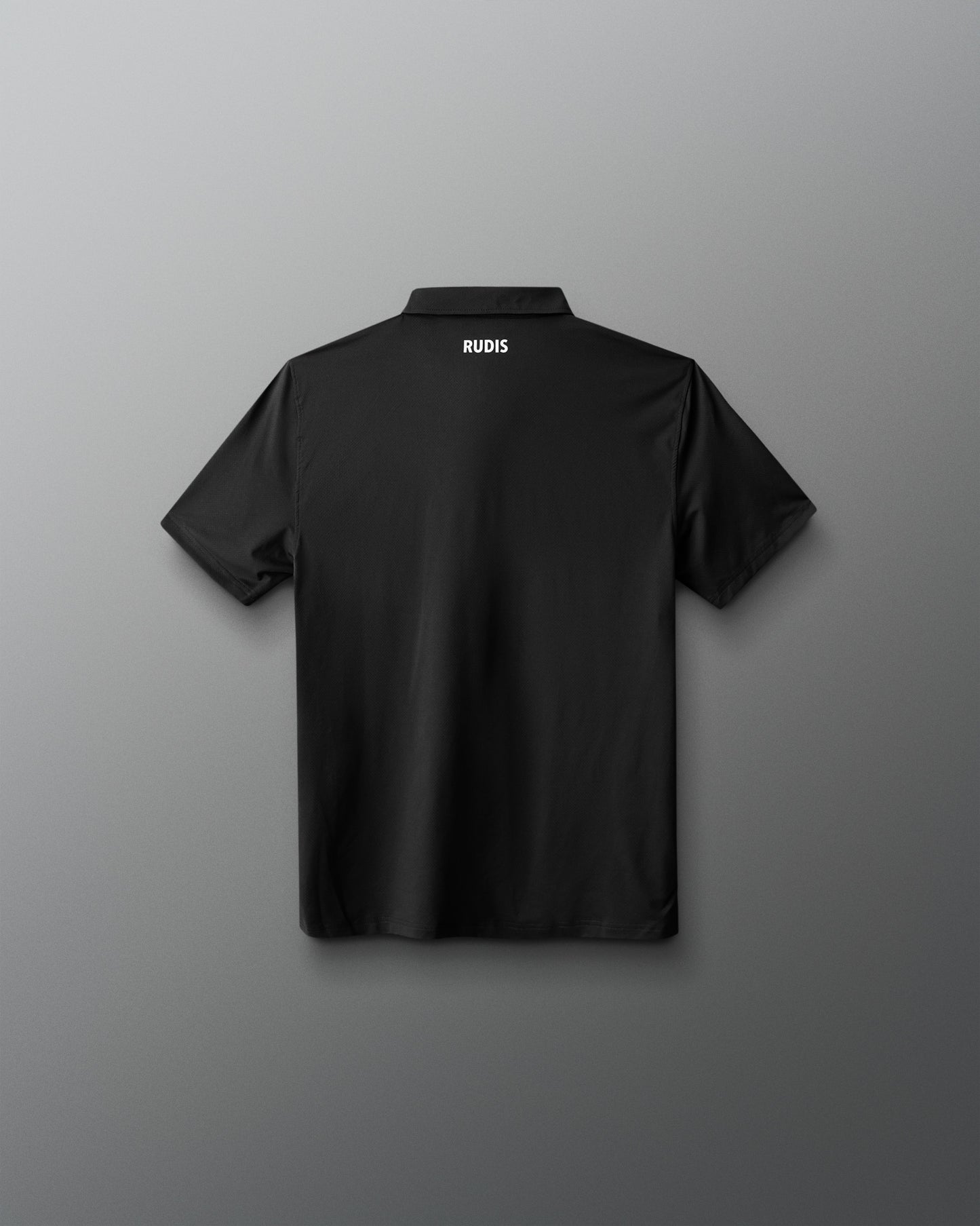 Black polo shirt with 'RUDIS' branding on the back against a gray background