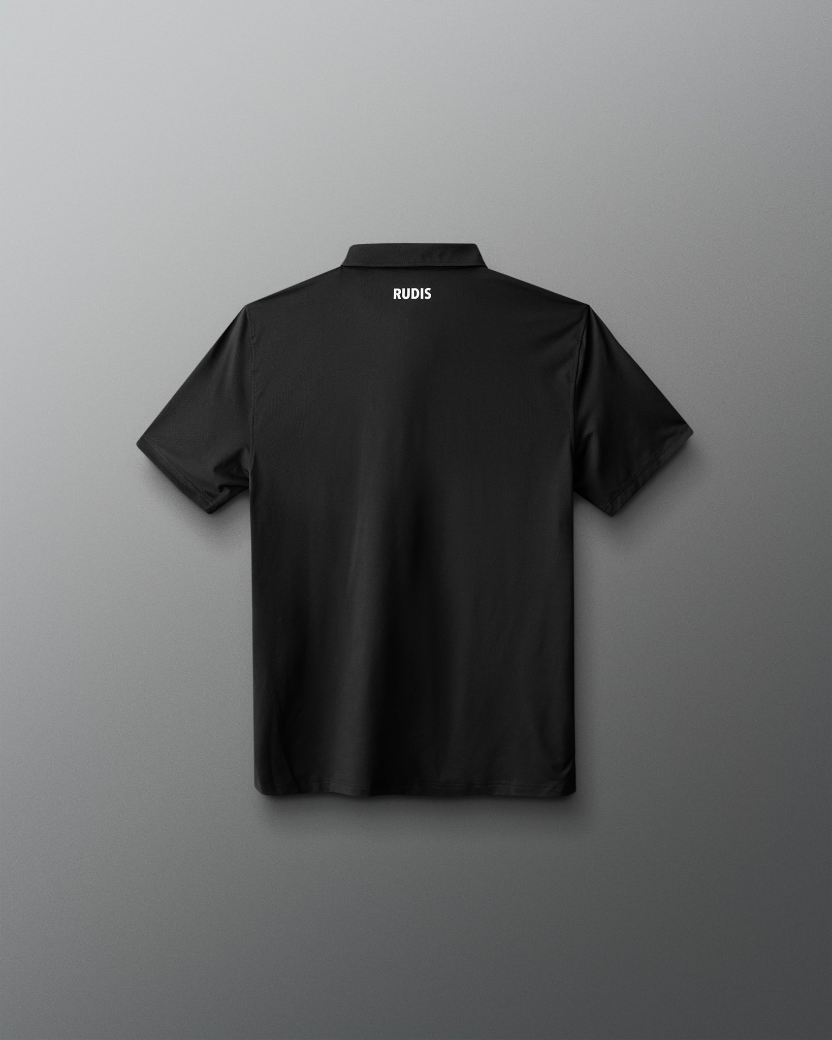 Black polo shirt with 'RUDIS' branding on the back against a gray background