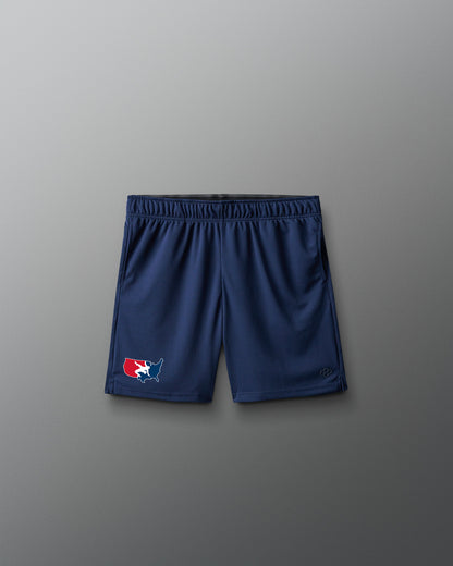 A pair of navy blue athletic shorts with an elastic waistband, featuring a small red, white, and blue logo on the left leg, displayed against a neutral gray background.