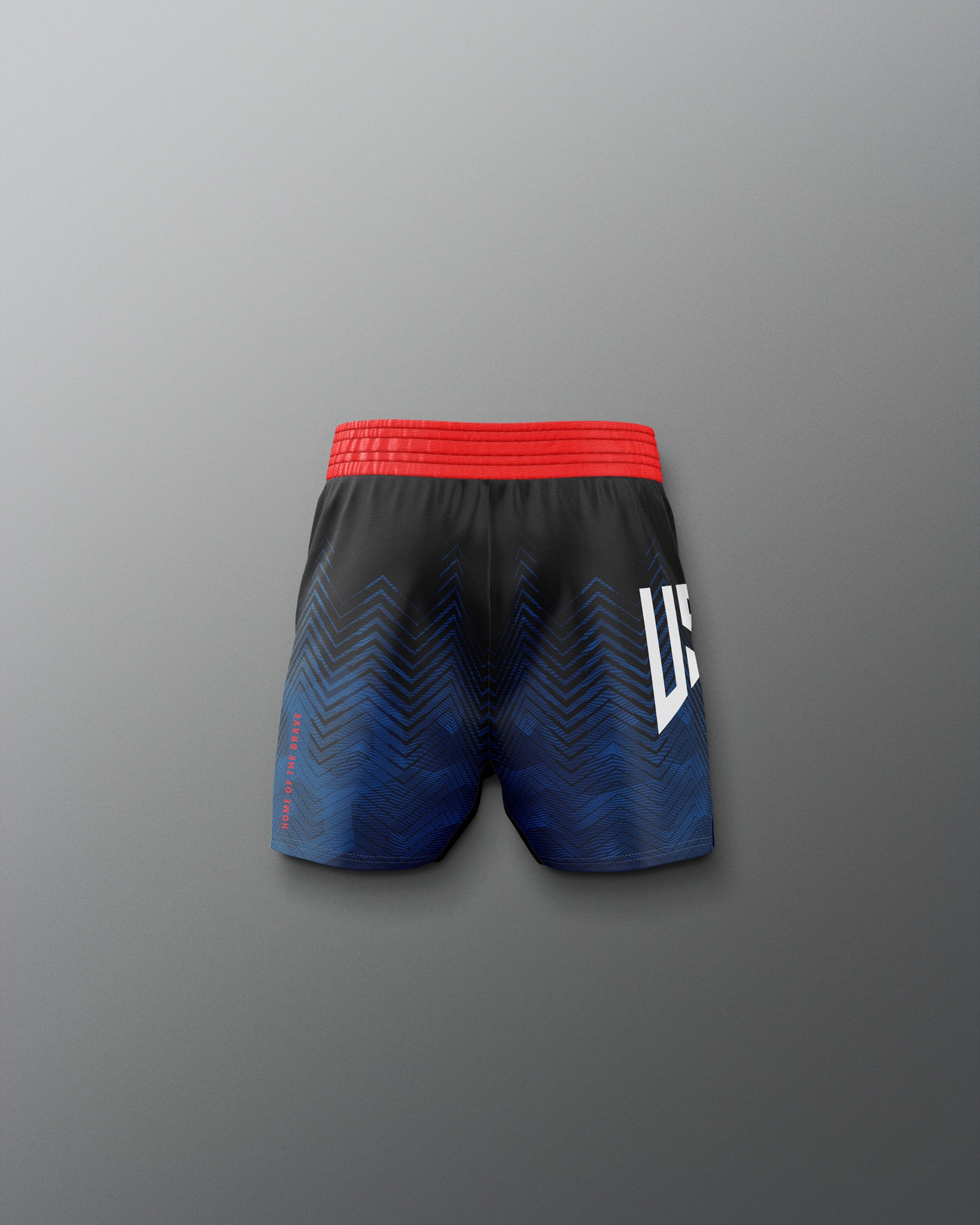 Black and blue athletic shorts with red waistband on a gray background