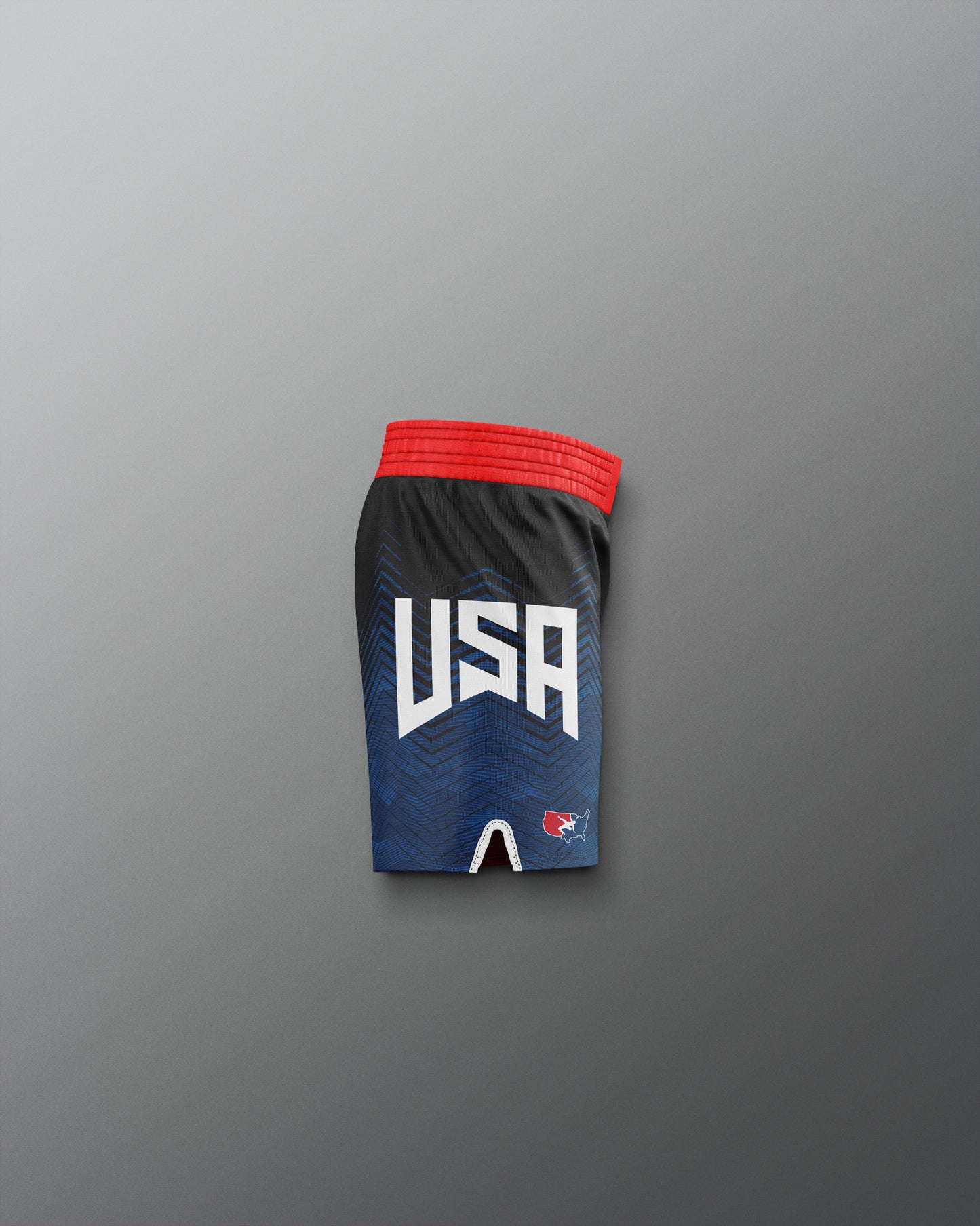 Black athletic shorts with 'USA' text on a gradient blue and red background