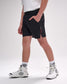 Person wearing black shorts with a red zipper on a white background