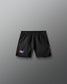 Black shorts with a USa Wrestling logo on a gray background