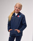 Child wearing a navy blue jacket with a logo on a gray background