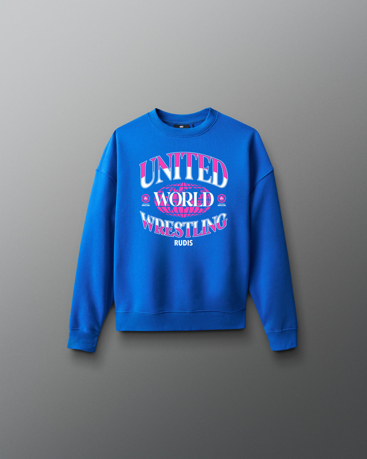 Youth royal blue RUDIS UWW Globe Relaxed Comfort Fleece Crewneck shown from the front, featuring a bold pink-and-white “UNITED WORLD WRESTLING” globe graphic across the chest with RUDIS branding below.