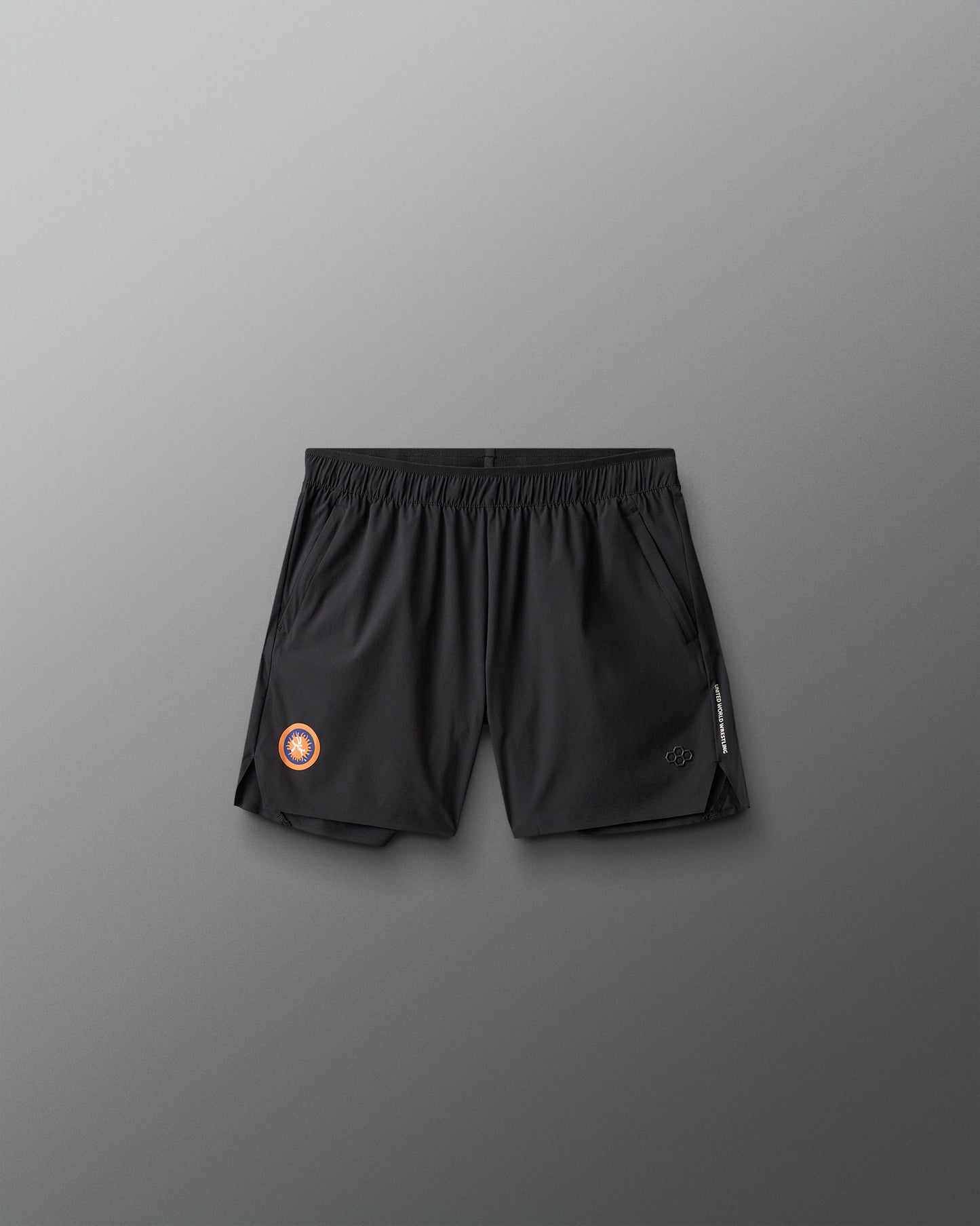 Black athletic shorts with a United World Wrestling logo on a gray background