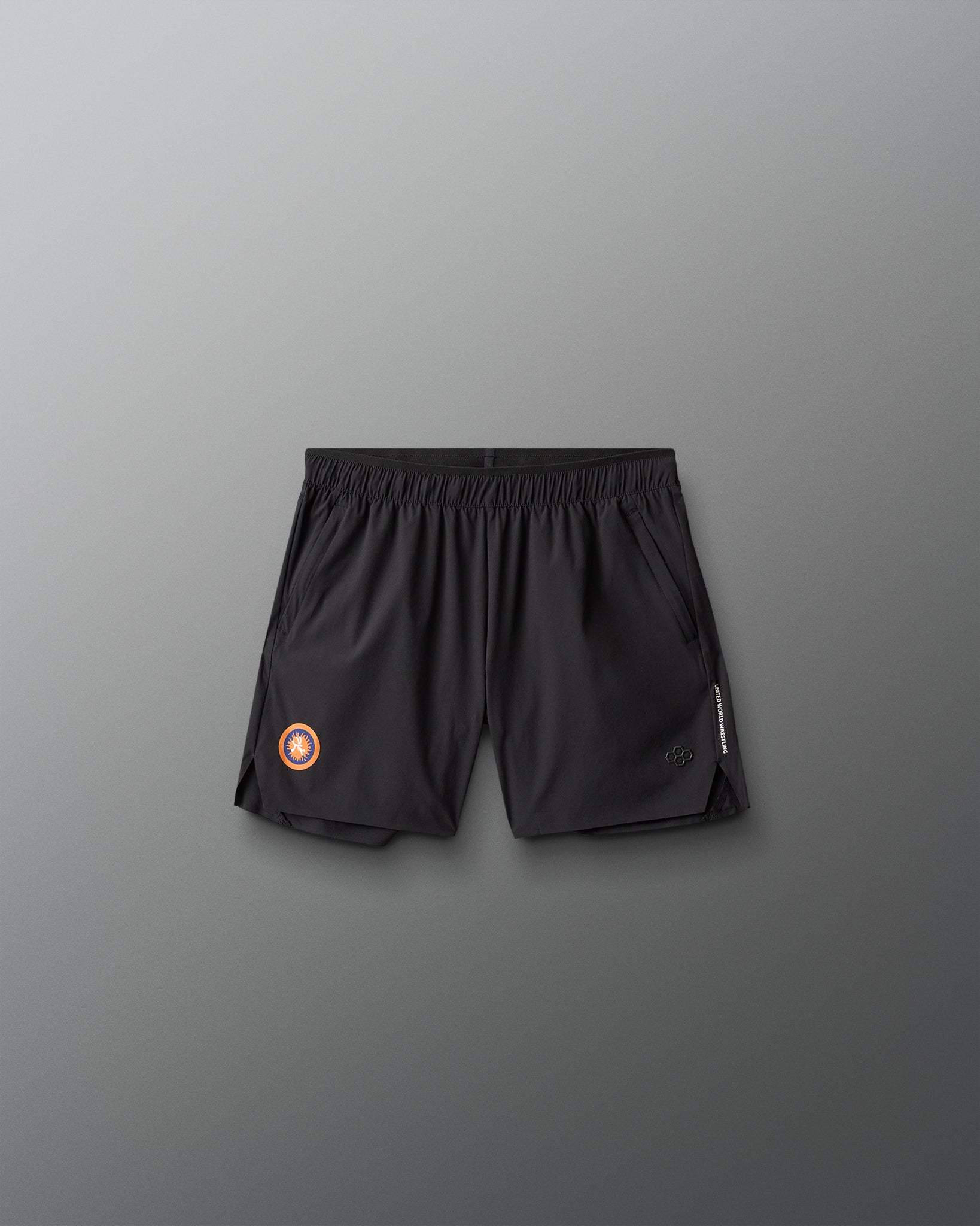 Black athletic shorts with a United World Wrestling logo on a gray background