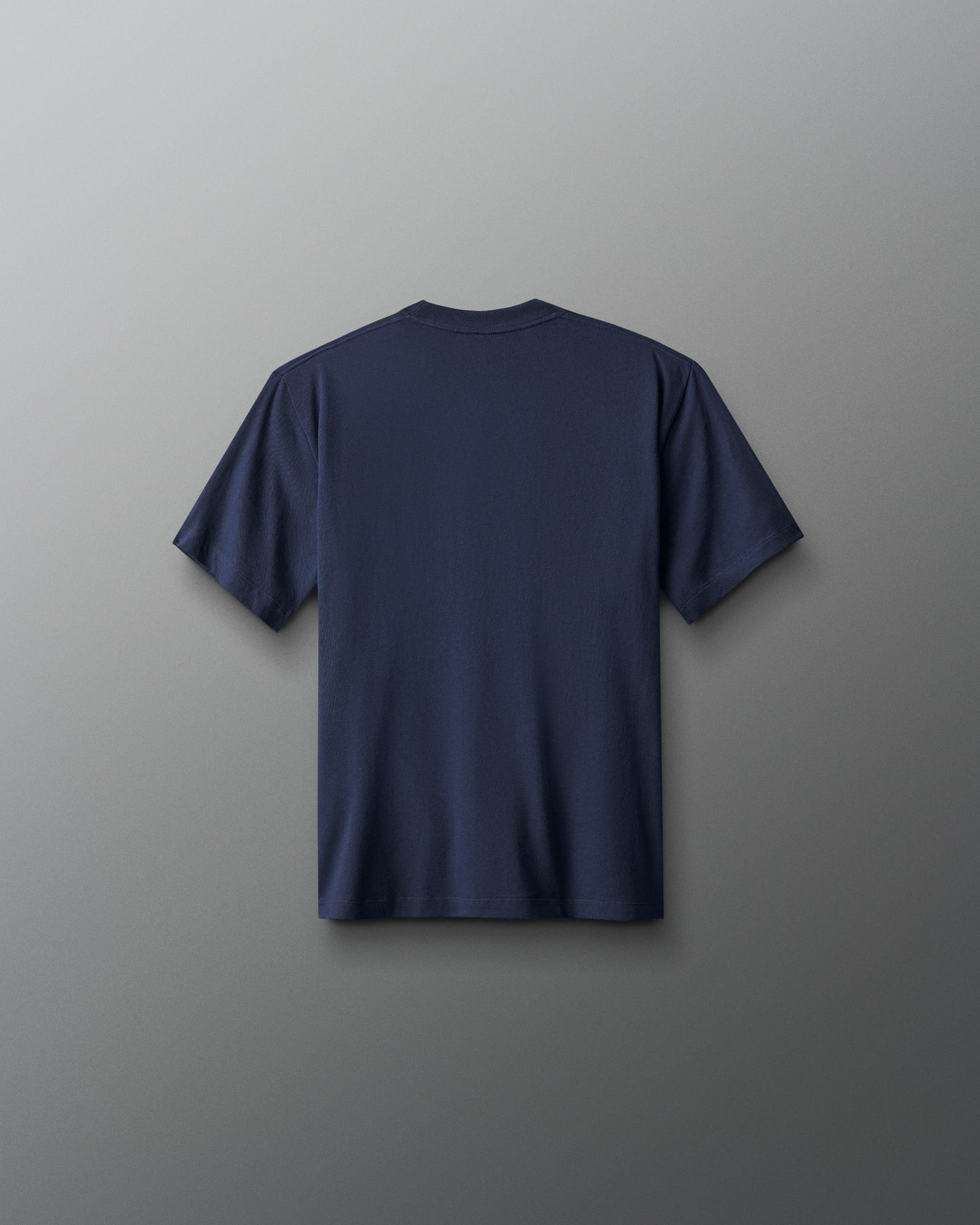 Navy blue t-shirt on a gray background