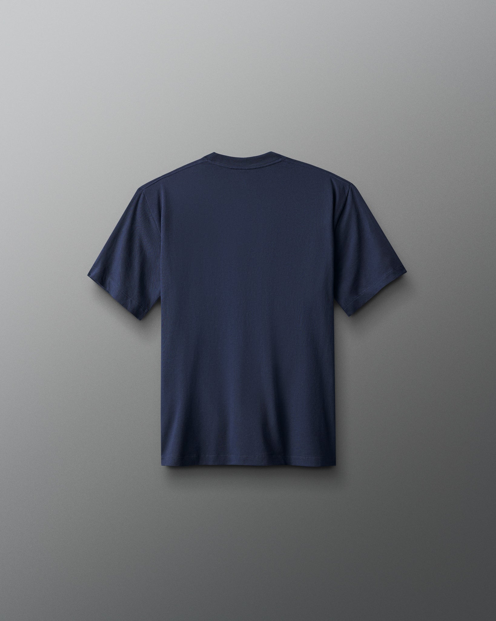 Navy blue t-shirt on a gray background
