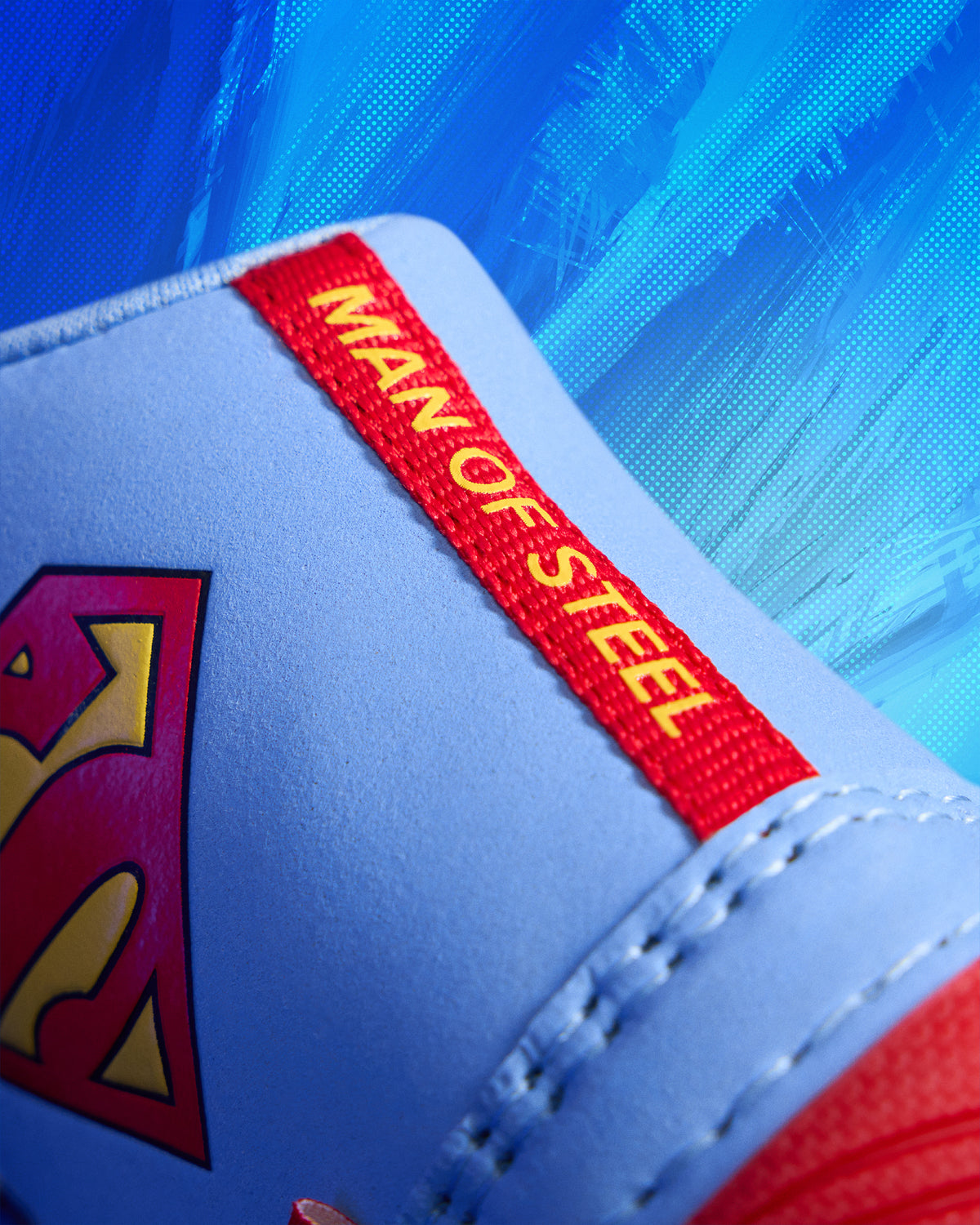 Detail view of the RUDIS JB1 Superman wrestling shoe heel featuring the Superman shield and red Man of Steel pull tab.