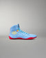 Side profile of RUDIS JB1 Superman wrestling shoe showing light blue mesh upper, yellow RUDIS logo and red traction outsole.