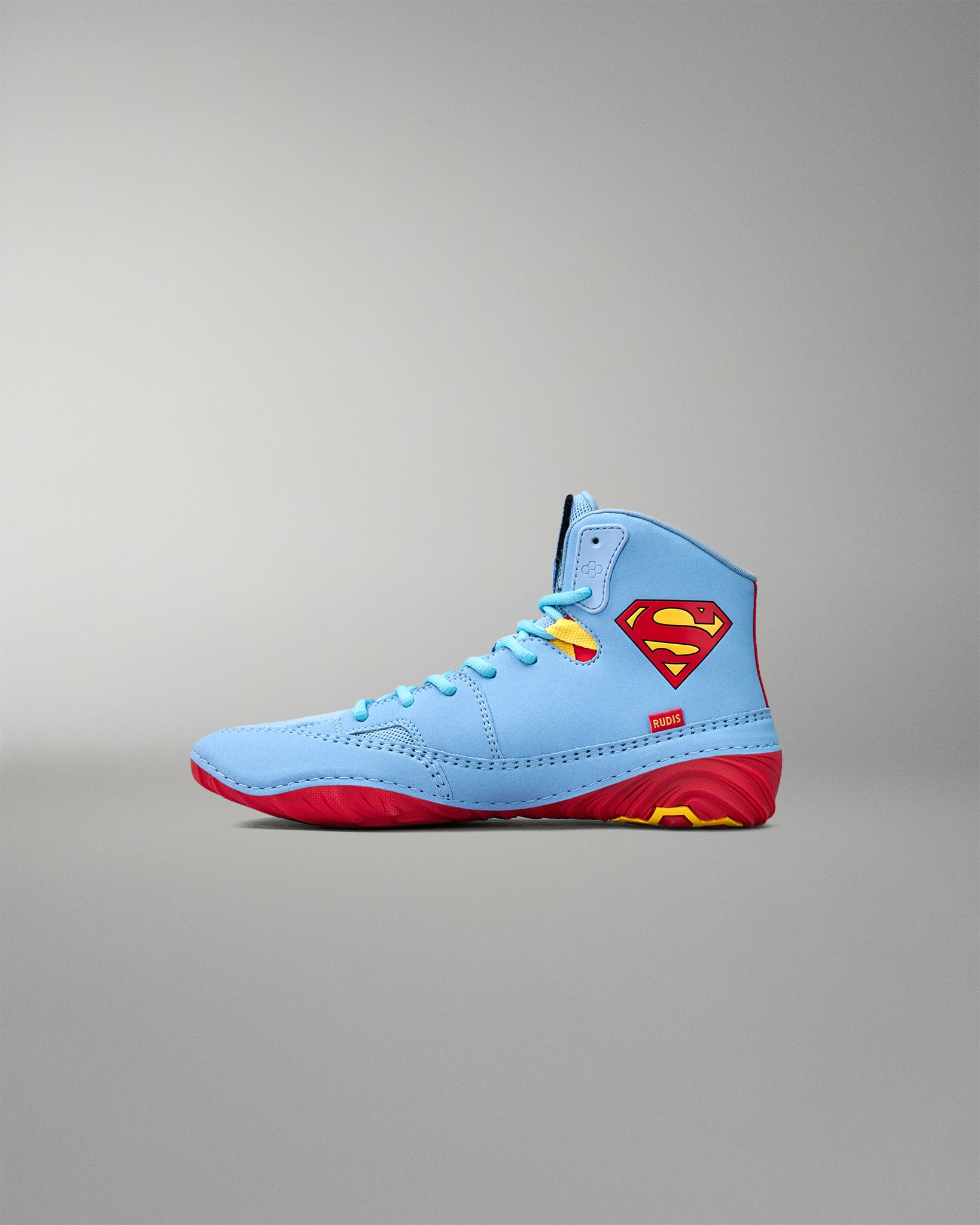Opposite side view of RUDIS JB1 Superman wrestling shoe featuring the iconic red and yellow Superman shield.