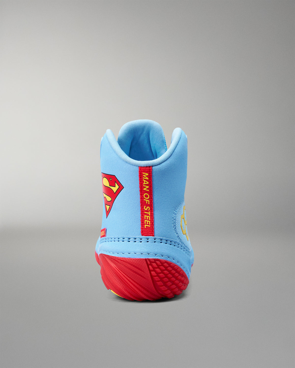 Rear view of RUDIS JB1 Superman wrestling shoe with red Man of Steel heel tab and Superman branding.